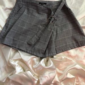 Sophisticated belted plaid skort